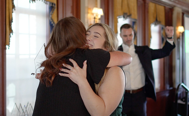 Oklahoma Kickoff Highlight Image of Employees on Stage Receiving Award with Jason Cashion